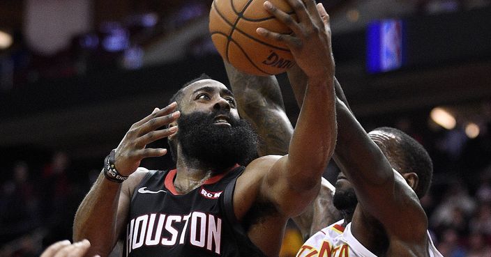 Houston Rockets guard James Harden (13) drives to the basket as Atlanta Hawks center Dewayne Dedmon (14) defends during the second half of an NBA basketball game, Monday, Feb. 25, 2019, in Houston. (AP Photo/Eric Christian Smith)