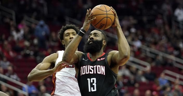 Houston Rockets' James Harden (13) goes up for a shot as Miami Heat's Josh Richardson defends during the second half of an NBA basketball game Thursday, Feb. 28, 2019, in Houston. The Rockets won 121-118. (AP Photo/David J. Phillip)