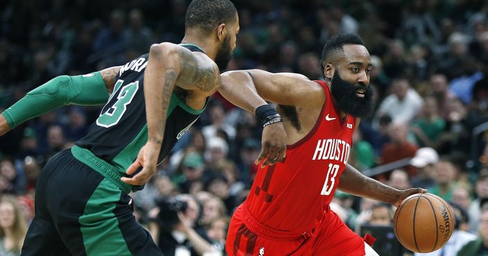 Houston Rockets' James Harden, right, drives past Boston Celtics' Marcus Morris during the second half of an NBA basketball game in Boston, Sunday, March 3, 2019. (AP Photo/Michael Dwyer)