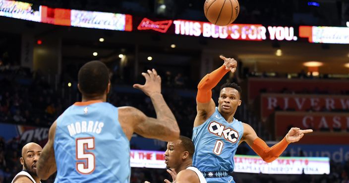 Oklahoma City Thunder guard Russell Westbrook (0) passes the ball over Memphis Grizzlies guard Avery Bradley to Oklahoma City Thunder forward Markieff Morris (5) in the second half of an NBA basketball game, Sunday, March 3, 2019, in Oklahoma City. (AP Photo/Kyle Phillips)
