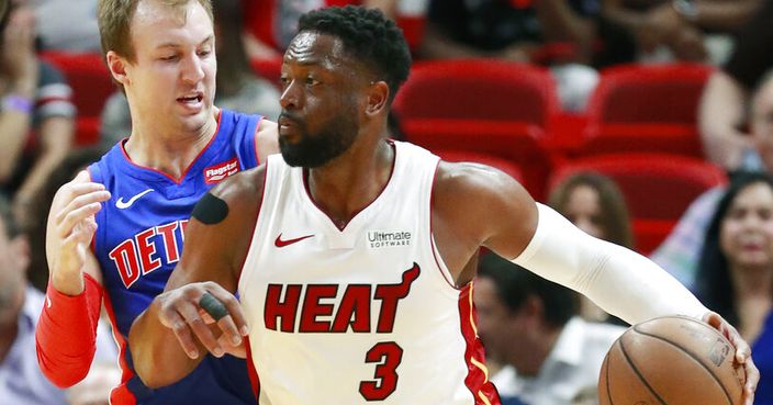 Miami Heat guard Dwyane Wade (3) drives against Detroit Pistons guard Luke Kennard during the first half of an NBA basketball game, Wednesday, March 13, 2019, in Miami. (AP Photo/Wilfredo Lee)