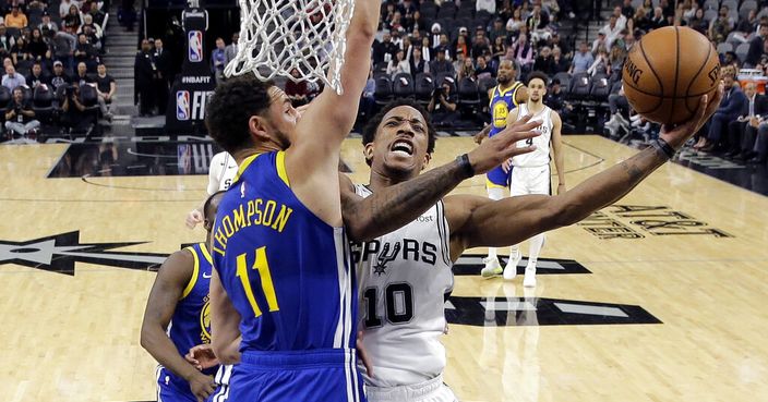 San Antonio Spurs guard DeMar DeRozan (10) drives to the basket against Golden State Warriors guard Klay Thompson (11) during the second half of an NBA basketball game in San Antonio, Monday, March 18, 2019. (AP Photo/Eric Gay)