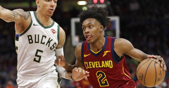 Cleveland Cavaliers' Collin Sexton (2) drives past Milwaukee Bucks' D.J. Wilson (5) during the second half of an NBA basketball game Wednesday, March 20, 2019, in Cleveland. The Cavaliers won 107-102. (AP Photo/Tony Dejak)
