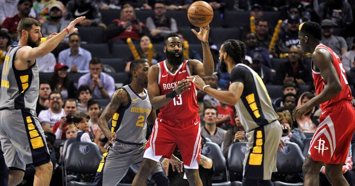 Houston Rockets guard James Harden (13) looks to pass while guarded by Memphis Grizzlies guards Delon Wright (2) and Mike Conley, center right, during the first half of an NBA basketball game Wednesday, March 20, 2019, in Memphis, Tenn. (AP Photo/Brandon Dill)