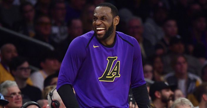 Los Angeles Lakers forward LeBron James laughs as he waits to check in to the team's NBA basketball game against the Charlotte Hornets during the second half Friday, March 29, 2019, in Los Angeles. The Lakers won 129-115. (AP Photo/Mark J. Terrill)