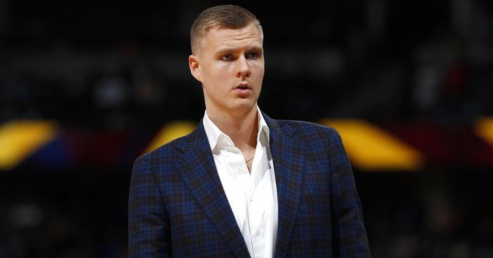 FILE - In this March 14, 2019, file photo, Dallas Mavericks forward Kristaps Porzingis stands during the second half of the team's NBA basketball game against the Denver Nuggets in Denver. An attorney for Porzingis acknowledges that a woman has accused the NBA star of rape, but “unequivocally” denies the allegation. Lawyer Roland Riopelle said Saturday, March 30, that the claim against the Dallas Maverick was part of an extortion attempt that is being investigated by the FBI. (AP Photo/David Zalubowski, File)