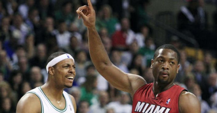 Miami Heat guard Dwyane Wade (3) signals as Boston Celtics forward Paul Pierce (34) reacts during the first quarter in Game 6 of the NBA basketball Eastern Conference finals, Thursday, June 7, 2012, in Boston. (AP Photo/Elise Amendola)