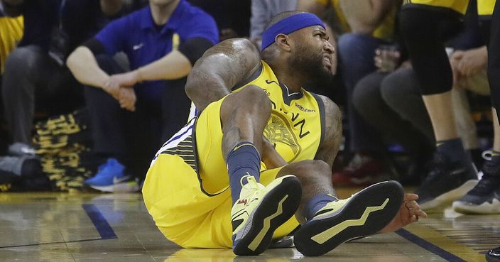 Golden State Warriors center DeMarcus Cousins reacts after falling to the floor during the first half of Game 2 of a first-round NBA basketball playoff series against the Los Angeles Clippers in Oakland, Calif., Monday, April 15, 2019. (AP Photo/Jeff Chiu)