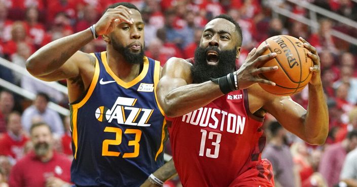 Houston Rockets guard James Harden (13) drives against Utah Jazz forward Royce O'Neale (23) during the first half of Game 2 of a first-round NBA basketball playoff series in Houston, Wednesday, April 17, 2019. (AP Photo/David J. Phillip)