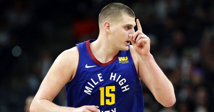 Denver Nuggets center Nikola Jokic (15) runs upcourt after scoring against the San Antonio Spurs during the second half of Game 4 of an NBA basketball playoff series in San Antonio, Saturday, April 20, 2019. Denver won 117-103. (AP Photo/Eric Gay)