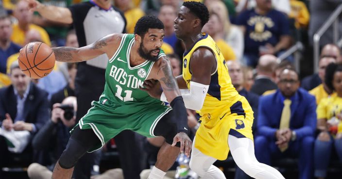 Boston Celtics guard Kyrie Irving (11) drives on Indiana Pacers guard Darren Collison (2) during the second half of Game 4 of an NBA basketball first-round playoff series in Indianapolis, Sunday, April 21, 2019. The Celtics defeated the Pacers 110-106 to win the series 4-0. (AP Photo/Michael Conroy)