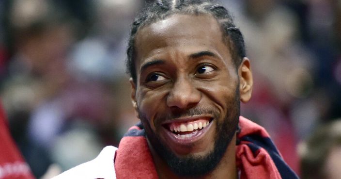 Toronto Raptors forward Kawhi Leonard (2) smiles from the bench during a late second half timeout in Game 5 of a first-round NBA basketball playoff series against the Orlando Magic, Tuesday, April 23, 2019 in Toronto. (Frank Gunn/Canadian Press via AP)