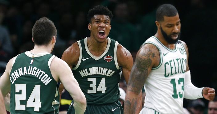 Milwaukee Bucks' Giannis Antetokounmpo (34) reacts after making a basket and drawing a foul as Boston Celtics' Marcus Morris (13) turns away during the second half of Game 4 of a second-round NBA basketball playoff series in Boston, Monday, May 6, 2019. (AP Photo/Michael Dwyer)
