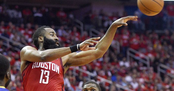 Houston Rockets guard James Harden (13) passes the ball as Golden State Warriors center Kevon Looney (5) watches during the second half of Game 4 of a second-round NBA basketball playoff series, Monday, May 6, 2019, in Houston. (AP Photo/Eric Christian Smith)