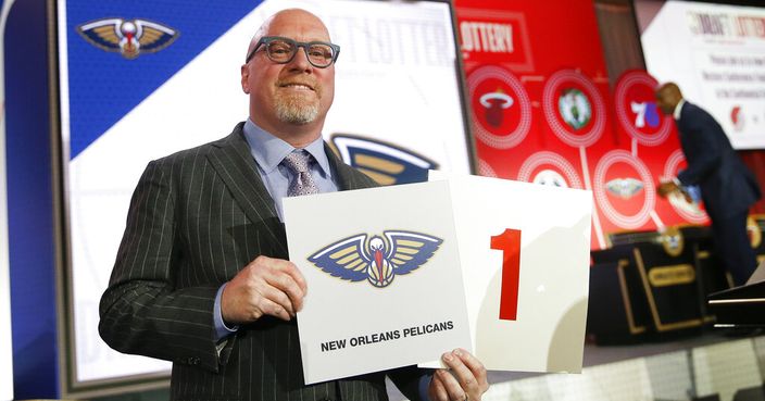 David Griffin, New Orleans Pelicans executive vice president of basketball operations, holds up placards after it was announced that the Pelicans had won the first pick during the NBA basketball draft lottery Tuesday, May 14, 2019, in Chicago. (AP Photo/Nuccio DiNuzzo)