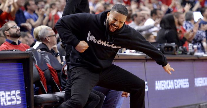 Drake reacts to a 3-point basket during the second half of Game 6 of the NBA basketball playoffs Eastern Conference finals between the Toronto Raptors and the Milwaukee Bucks on Saturday, May 25, 2019, in Toronto. (Nathan Denette/The Canadian Press via AP)