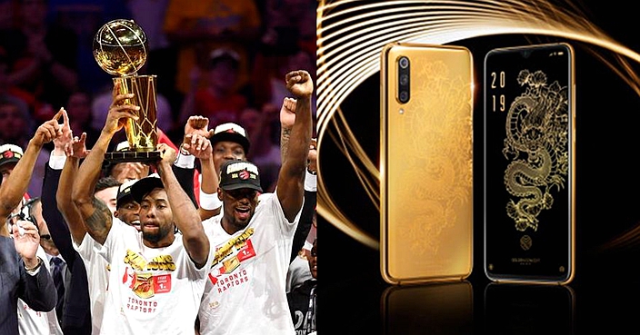 Toronto Raptors forward Kawhi Leonard, centre, holds Larry O'Brien NBA Championship Trophy after the Raptors defeated the Golden State Warriors 114-110 in Game 6 of basketball’s NBA Finals, Thursday, June 13, 2019, in Oakland, Calif. (Frank Gunn/The Canadian Press via AP)