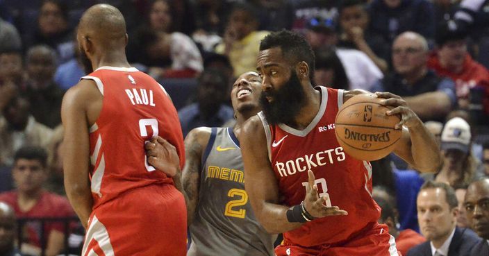 Houston Rockets guard James Harden (13) moves the ball against Memphis Grizzlies guard Delon Wright (2) as guard Chris Paul (3) sets a screen during the first half of an NBA basketball game Wednesday, March 20, 2019, in Memphis, Tenn. (AP Photo/Brandon Dill)