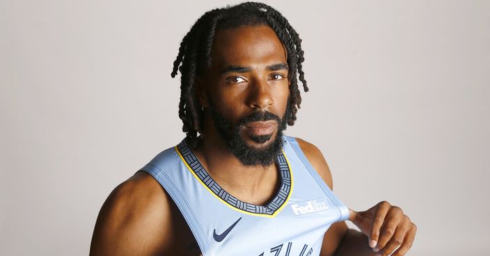 FILE - In this Sept. 24, 2018, file photo, Memphis Grizzlies guard Mike Conley poses during the team's NBA basketball media day  in Memphis, Tenn. A person with knowledge of the decision says the Memphis Grizzlies have traded veteran point guard Mike Conley, who has played the most games in franchise history, to the Utah Jazz. The person says the Grizzlies swapped Conley for Jae Crowder, Kyle Korver and Grayson Allen. The person spoke to The Associated Press Wednesday, June 19, 2019, on condition of anonymity because neither Memphis nor Utah has announced the trade. (AP Photo/File)
