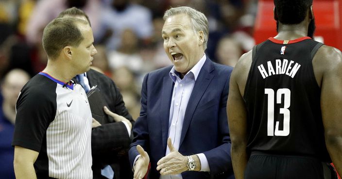 Houston Rockets coach Mike D'Antoni, center, yells at official John Goble, left, after James Harden (13) was given a technical foul during the second half of an NBA basketball game against the Detroit Pistons Thursday, March 22, 2018, in Houston. The Rockets won 100-96 in overtime. (AP Photo/David J. Phillip)