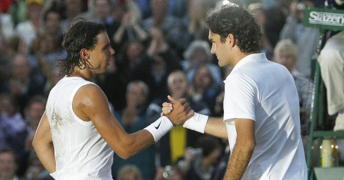 FILE - In this Sunday, July 6, 2008 file photo Spain's Rafael Nadal left, shakes the hand of Switzerland's Roger Federer after winning the men's final on the Centre Court at Wimbledon. After going more than 1½ years without playing each other anywhere, Roger Federer and Rafael Nadal will be meeting at a second consecutive Grand Slam tournament when they face off in Wimbledon's semifinals. (AP Photo/Anja Niedringhaus, File)