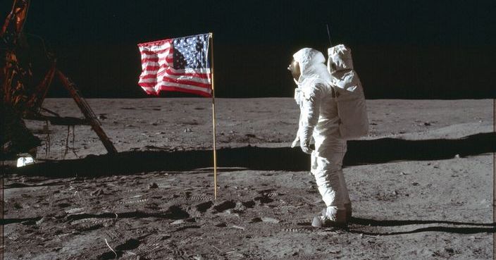 In this July 20, 1969 photo made available by NASA, astronaut Buzz Aldrin Jr. poses for a photograph beside the U.S. flag on the moon during the Apollo 11 mission. Aldrin and fellow astronaut Neil Armstrong were the first men to walk on the lunar surface with temperatures ranging from 243 degrees above to 279 degrees below zero. Astronaut Michael Collins flew the command module. (Neil Armstrong/NASA via AP)
