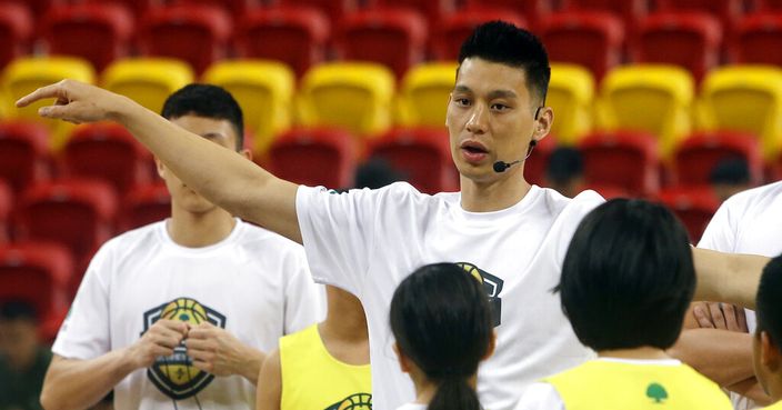Former Toronto Raptors' Jeremy Lin, currently a free agent, talks to young Taiwanese players during a basketball clinic in Taipei, Taiwan, Saturday, July 27, 2019. Lin is in Taiwan to attend a charity event and basketball clinics for young athletes. (AP Photo/Chiang Ying-ying)