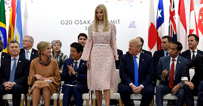 Ivanka Trump stands up to speak at the President G-20 summit event on women's empowerment in Osaka, Japan, in Osaka, Japan, Saturday, June 29, 2019. President Donald Trump, center right, also attends. (AP Photo/Susan Walsh)