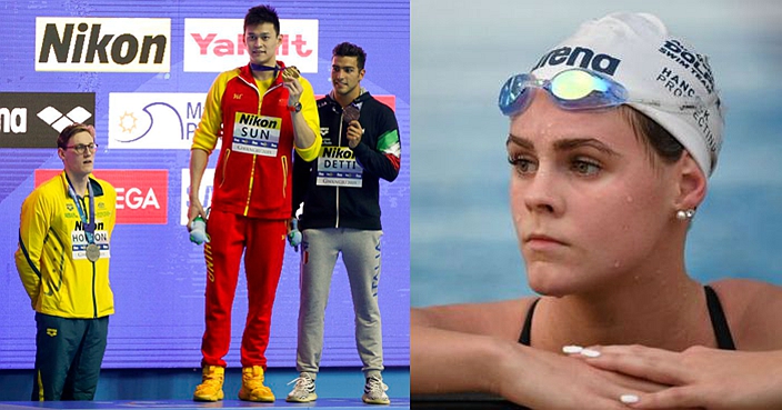 China's Sun Yang, centre, holds up his gold medal as silver medalist Australia's Mack Horton, left, stands away from the podium and bronze medalist Italy's Gabriele Detti after the men's 400m freestyle final at the World Swimming Championships in Gwangju, South Korea, Sunday, July 21, 2019. (AP Photo/Mark Schiefelbein)