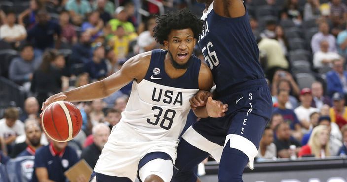 Team White forward Marvin Bagley III (38) dribbles the ball under pressure from Team Blue center Myles Turner (56) during the first half of the U.S. men's basketball team's scrimmage in Las Vegas, Friday, Aug. 9, 2019. (Erik Verduzco/Las Vegas Review-Journal via AP)