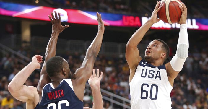 Team White guard Jalen Brunson (60) goes up for a shot under pressure from Team Blue guard Kemba Walker (26) during the first half of the U.S. men's basketball team's scrimmage in Las Vegas, Friday, Aug. 9, 2019. (Erik Verduzco/Las Vegas Review-Journal via AP)