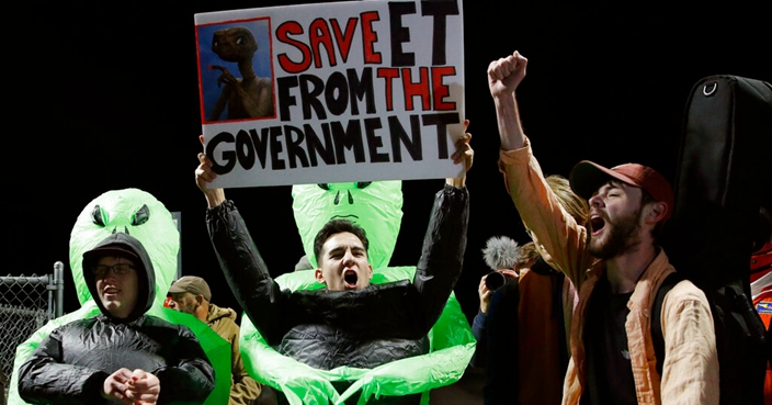 Mario Rayna, center, chants with others at an entrance to the Nevada Test and Training Range near Area 51 Friday, Sept. 20, 2019, near Rachel, Nev. People gathered at the gate inspired by the 