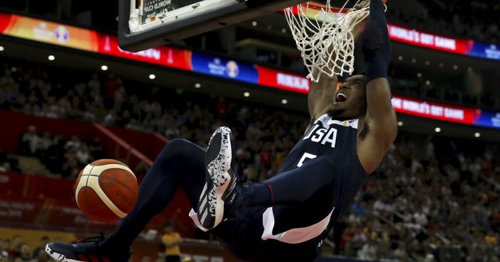 United States' Donovan Mitchell dunks during a Group E match against Czech Republic for the FIBA Basketball World Cup at the Shanghai Oriental Sports Center in Shanghai on Sunday, Sept. 1, 2019. U.S. defeats Czech Republic 88-67. (AP Photo/Ng Han Guan)