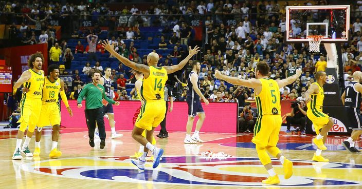 Members of Brazil's team celebrate after beating Greece in their group stage match in the FIBA Basketball World Cup in Nanjing in eastern China's Jiangsu province, Tuesday, Sept. 3, 2019. (Chinatopix via AP)