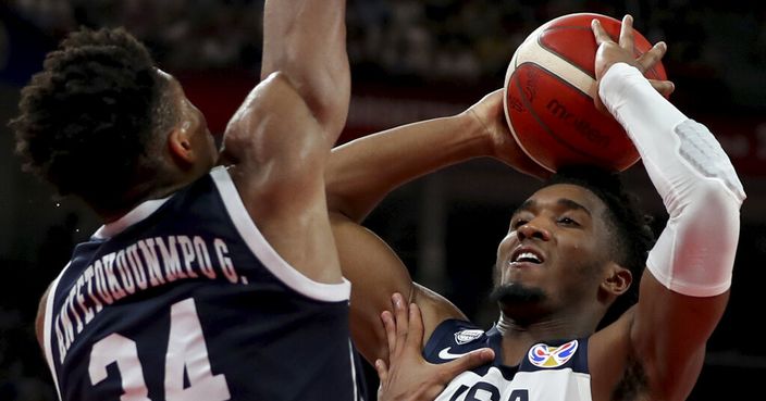 Greece's Giannis Antetokounmpo tries to block United States' Donovan Mitchell during phase two of the FIBA Basketball World Cup at the Shenzhen Bay Sports Center in Shenzhen in southern China's Guangdong province on Saturday, Sept. 7, 2019. United States beats Greece 69-53. (AP Photo/Ng Han Guan)