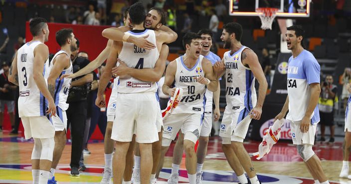Argentina's team celebrate after defeating Serbia during a quarterfinal match for the FIBA Basketball World Cup in Dongguan in southern China's Guangdong province on Tuesday, Sept. 10, 2019. Argentina beats Serbia 97-87. (AP Photo/Ng Han Guan)