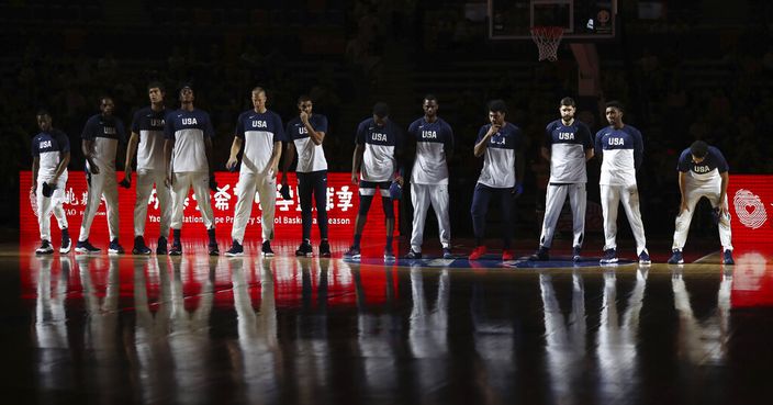 United States players line up for a consolation playoff game against Serbia for the FIBA Basketball World Cup in Dongguan in southern China's Guangdong province on Thursday, Sept. 12, 2019. The U.S. will leave the World Cup with its worst finish ever in a major international tournament, assured of finishing no better than seventh after falling to Serbia 94-89 in a consolation playoff game on Thursday night. (AP Photo/Ng Han Guan)