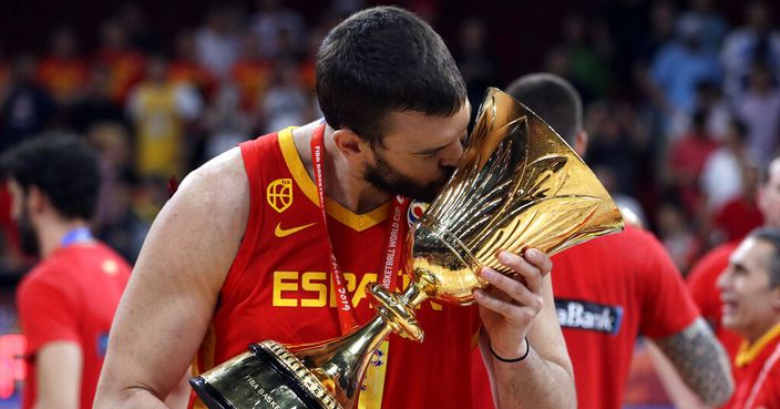 Marc Gasol of Spain celebrates with the Naismith Trophy after they beat Argentina in their first-place match in the FIBA Basketball World Cup at the Cadillac Arena in Beijing, Sunday, Sept. 15, 2019. (AP Photo/Mark Schiefelbein)