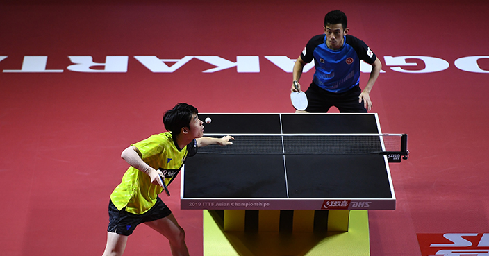 YOGYAKARTA, INDONESIA - SEPTEMBER 15: Jang Woojin of Korea (yellow) competes against Wong Chun Ting of Hong Kong (blue) during day one of the ITTF-Asian Table Tennis Championships at Among Raga Stadium on September 15, 2019 in Yogyakarta, Indonesia. (Photo by Robertus Pudyanto/Getty Images)