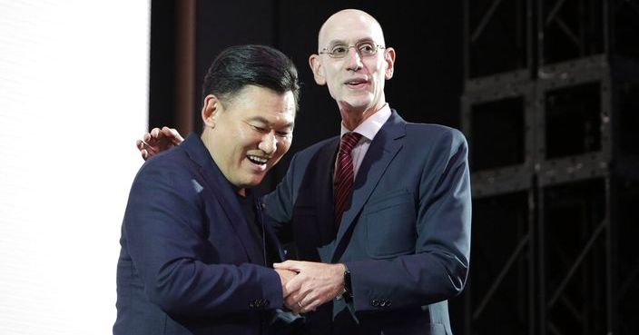 NBA Commissioner Adam Silver, right, and Rakuten, Inc. Chairman & CEO Mickey Mikitani greet each other during a welcome reception for the NBA Japan Games 2019 between the Toronto Raptors and the Houston Rockets in Tokyo, Monday, Oct. 7, 2019. (AP Photo/Kiichiro Sato)