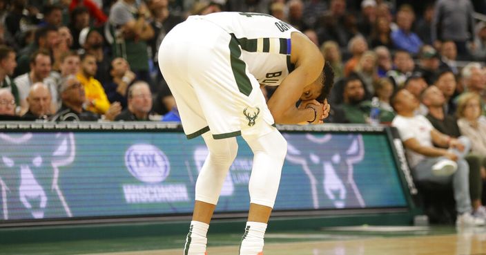 Milwaukee Bucks' Giannis Antetokounmpo reacts after fouling out in the overtime against the Miami Heat during an NBA game Saturday, Oct. 26, 2019, in Milwaukee. (AP Photo/Jeffrey Phelps)