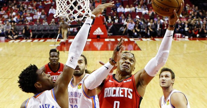 Houston Rockets guard Russell Westbrook (0) drives to the basket as Oklahoma City Thunder guard Shai Gilgeous-Alexander (2) defends during the first half of an NBA basketball game, Monday, Oct. 28, 2019, in Houston. (AP Photo/Eric Christian Smith)
