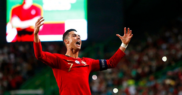 Portugal's Cristiano Ronaldo celebrates after scoring his side's second goal during a Euro 2020 group B qualifying soccer match between Portugal and Luxembourg at the Jose Alvalade stadium in Lisbon, Friday, Oct 11, 2019. (AP Photo/Armando Franca)