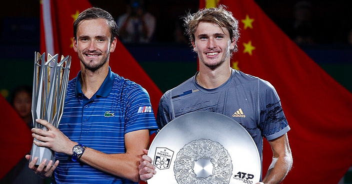 Daniil Medvedev of Russia, left, and Alexander Zverev of Germany pose with their trophies after the final of the men's final at the Shanghai Masters tennis tournament at Qizhong Forest Sports City Tennis Center in Shanghai, China, Sunday, Oct. 13, 2019. Medvedev defeated Zverev 6-4, 6-1. (AP Photo/Andy Wong)