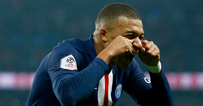 PSG's Kylian Mbappe celebrates after scoring his side goal during the French League One soccer match between PSG and Marseille at the Parc des Princes stadium in Paris, France, Sunday, Oct. 27, 2019. (AP Photo/Kamil Zihnioglu)