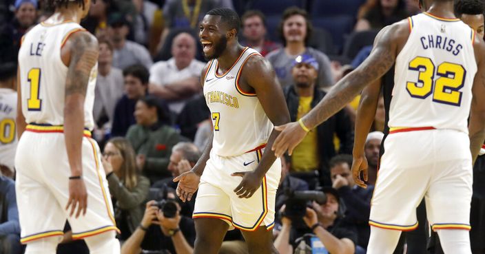 Golden State Warriors forward Eric Paschall (7) celebrates with guard Damion Lee (1) and forward Marquese Chriss (32) during the second half of an NBA basketball game against the Portland Trail Blazers in San Francisco, Monday, Nov. 4, 2019. (AP Photo/Jeff Chiu)