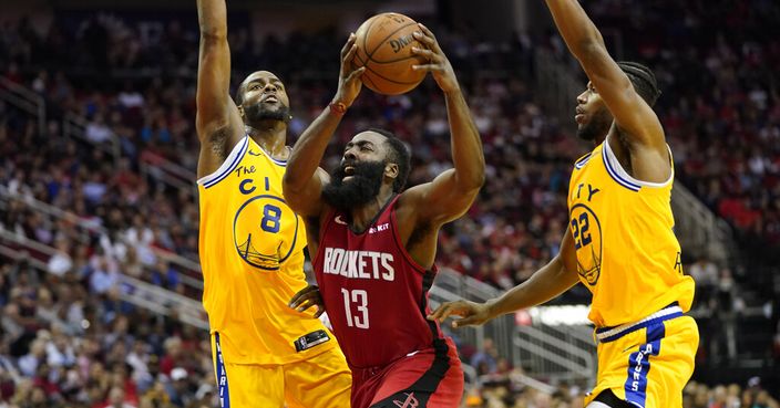Houston Rockets' James Harden (13) is fouled by Golden State Warriors' Alec Burks (8) as Glenn Robinson III (22) helps defend during the second half of an NBA basketball game Wednesday, Nov. 6, 2019, in Houston. The Rockets won 129-112. (AP Photo/David J. Phillip)