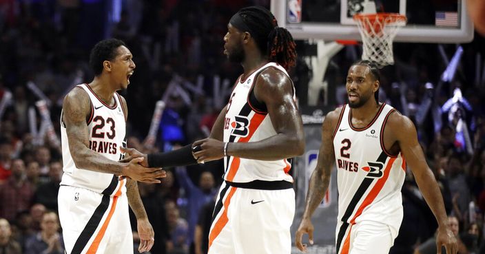 Los Angeles Clippers' Lou Williams (23) celebrates after making a 3-point basket with Montrezl Harrell, center, and Kawhi Leonard (2) during the second half of the team's NBA basketball game against the Portland Trail Blazers on Thursday, Nov. 7, 2019, in Los Angeles. (AP Photo/Marcio Jose Sanchez)