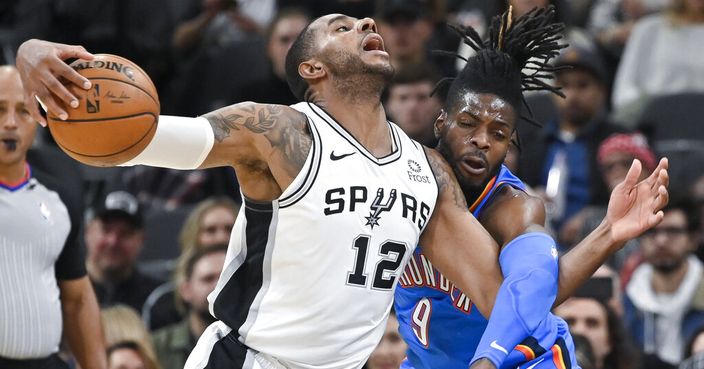 San Antonio Spurs' LaMarcus Aldridge (12) is fouled by Oklahoma City Thunder's Nerlens Noel during the first half of an NBA basketball game, Thursday, Nov. 7, 2019, in San Antonio. (AP Photo/Darren Abate)