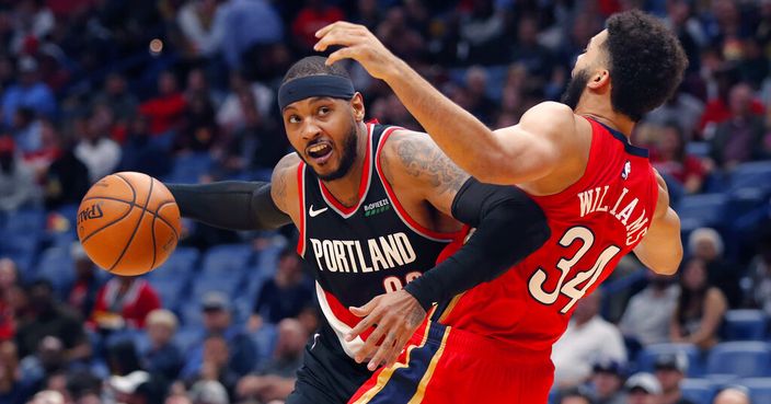 Portland Trail Blazers forward Carmelo Anthony is defended by New Orleans Pelicans guard Kenrich Williams (34) during the second half of an NBA basketball game in New Orleans, Tuesday, Nov. 19, 2019. The Pelicans won 115-104. (AP Photo/Gerald Herbert)